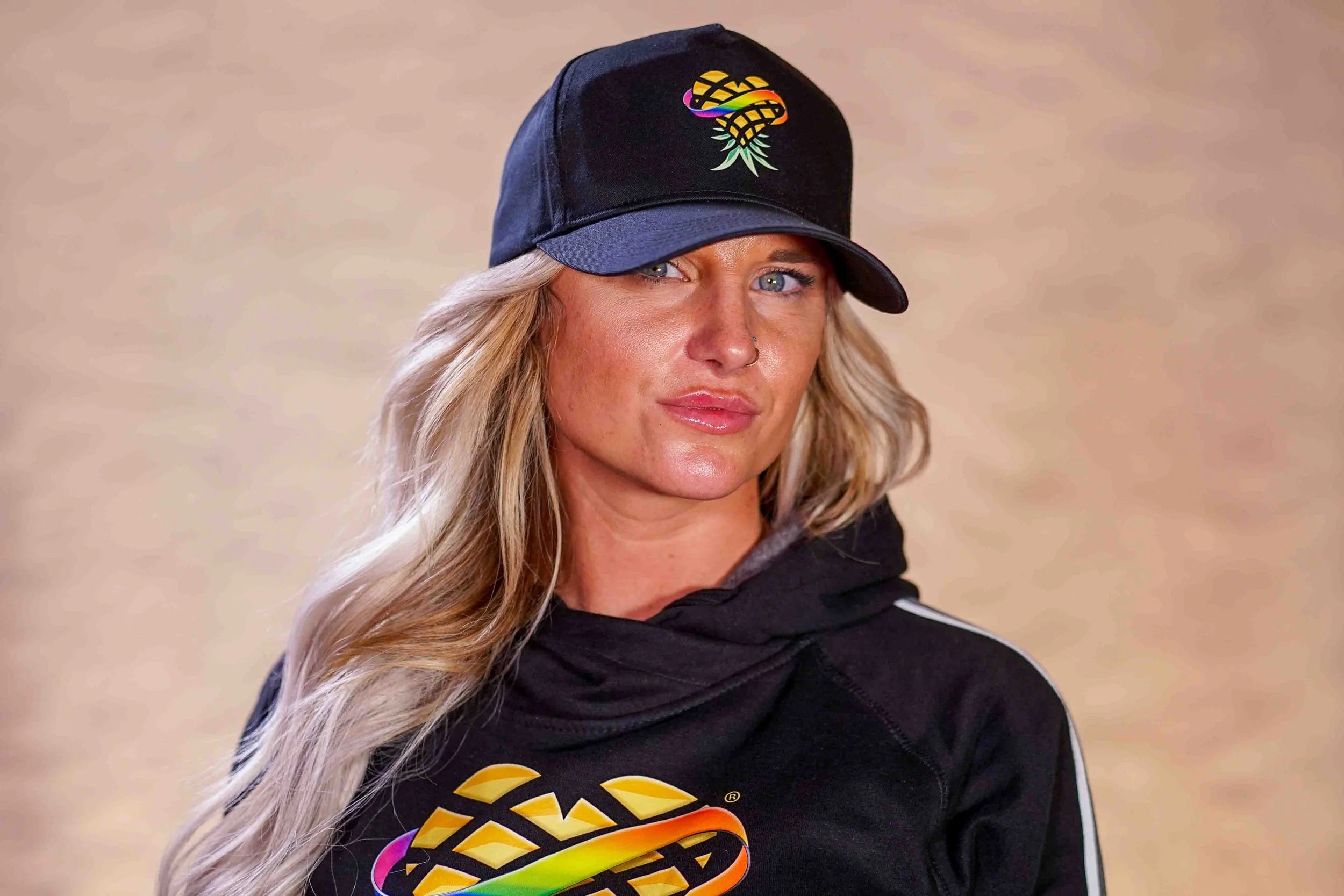 Blonde Woman Wearing Upside Down Pineapple Baseball Hat